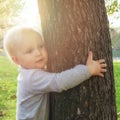 ÃÂ¡hild hugging a tree. Environment protection concept